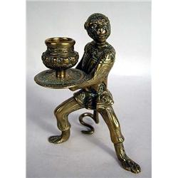 A BRASS SINGLE CANDLESTICK