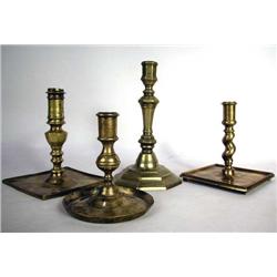 A BRASS SQUARE BASE CANDLESTICK