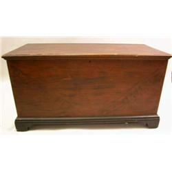 A BLACK AND RED PAINTED BLANKET CHEST