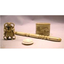 A COLLECTION OF BONE ITEMS COMPRISING: a netsuke, a "button", a scrimshawed covered circular box, an