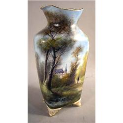 A HAND PAINTED PORCELAIN VASE