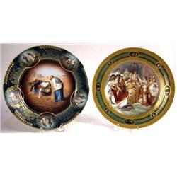 TWO PAINTED AND POLYCHROME DECORATED PORCELAIN PLATES