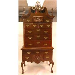 A CHIPPENDALE STYLE ELABORATELY-CARVED BONNET-TOP HIGH CHEST OF DRAWERS