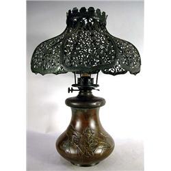 AN ARTS AND CRAFTS CAST BRONZE KEROSENE LAMP