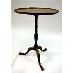 A GEORGE II FIGURED MAHOGANY PIE-CRUST CANDLESTAND