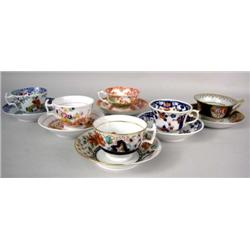 A GROUP OF SIX ASSORTED TEACUPS & SAUCERS