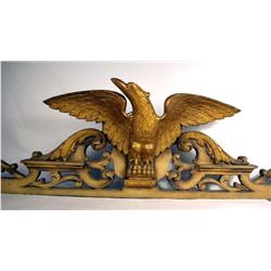 A CARVED PINE GILTWOOD WINGSPREAD EAGLE PLAQUE