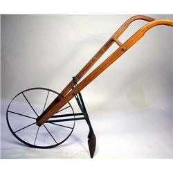 AN OAK AND STEEL SINGLE ROW SEED PLANTER