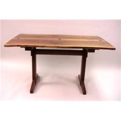 A GEORGE NAKASHIMA CHERRYWOOD TRESTLE BASE TABLE WITH BOOK MATCHED TOP JOINED BY THREE BUTTERFLIES