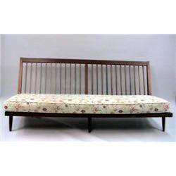 A GEORGE NAKASHIMA WALNUT ARMLESS SPINDLE BACK SOFA WITH LOOSE UPHOLSTERED CUSHIONS