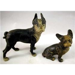 TWO CAST-IRON BLACK AND WHITE PAINTED DOGS