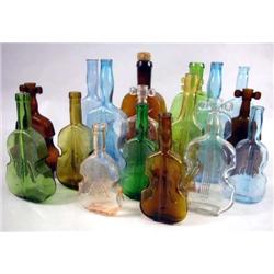 A MISCELLANEOUS GROUP OF COLORED GLASS "VIOLIN" BOTTLES