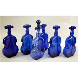 A MISCELLANEOUS GROUP OF COBALT BLUE GLASS "VIOLIN" BOTTLES: Randomly stamped 1 through 7 Height 8"