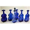Image 1 : A MISCELLANEOUS GROUP OF COBALT BLUE GLASS "VIOLIN" BOTTLES: Randomly stamped 1 through 7 Height 8"
