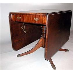 A MAHOGANY DROP LEAF DUNCAN PHYFE STYLE DINING TABLE