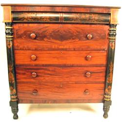 AN EMPIRE BLACK-PAINTED AND STENCIL-DECORATED FIGURED MAHOGANY CHEST OF DRAWERS