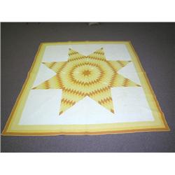 AN ORANGE, YELLOW AND WHITE PATCHWORK "STAR OF BETHLEHEM QUILT"