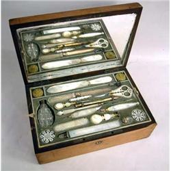 A VICTORIAN TACK-DECORATED MAHOGANY LADIES' TRAVELING TOILETRY BOX