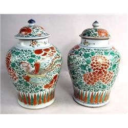A PAIR OF CHINESE LEAF-AND-VINE DECORATED TOBACCO JARS