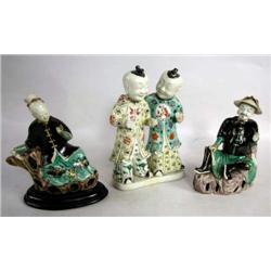 TWO POLYCHROME PORCELAIN SEATED FIGURAL GROUPS