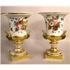 Image 1 : A PAIR OF NEOCLASSICAL FLORAL-DECORATED PARCEL-GILT URNS
