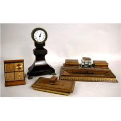 A TOOLED LEATHER DESK AND TRAVELING CLOCK