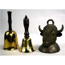 A PATINATED METAL BUFFALO HEAD BELL