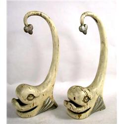 A PAIR OF WHITE-PAINTED STYLIZED DOLPHIN FORM FIGURALS