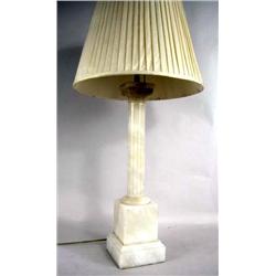 A NEOCLASSICAL STYLE CARVED STONE COLUMNAR LAMP