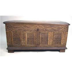 AN ELIZABETHAN CARVED OAK COFFER