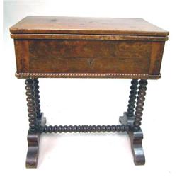 AN EMPIRE FIGURED MAHOGANY SWIVEL-TOP GAMES TABLE