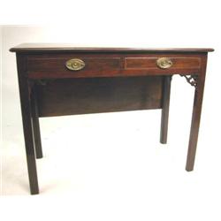 A GEORGE III MAHOGANY DROP-LEAF DINING TABLE