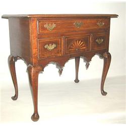 A QUEEN ANNE INLAID AND FIGURED WALNUT DRESSING TABLE