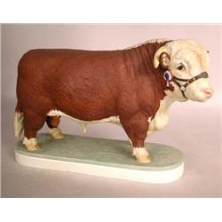 A ROYAL WORCESTER, ENGLAND, BONE CHINA FIGURE OF A HEREFORD BULL