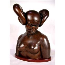 A WOODEN BUST OF A WOMAN