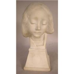AN ALABASTER BUST OF A YOUNG GIRL