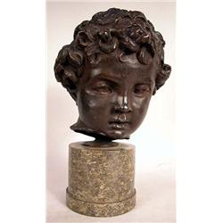 A PATINATED METAL BUST OF A YOUNG BOY ON MARBLE BASE