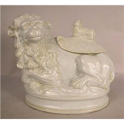 A LION-FORM COVERED CONTAINER