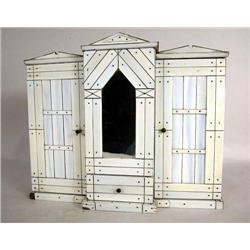 A MINIATURE IVORY THREE-SECTION ARMOIRE