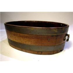 AN ENGLISH OVAL METAL BOUND WINE COOLER