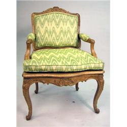 A LOUIS XV STYLE CARVED BEECHWOOD FAUTEUIL A LA REINE
