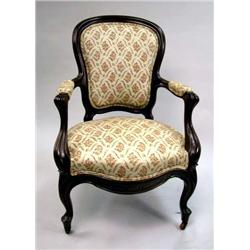 A VICTORIAN ROCOCO REVIVAL UPHOLSTERED ARMCHAIR