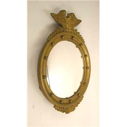 A FEDERAL STYLE CARVED GILTWOOD CONVEX LOOKING GLASS