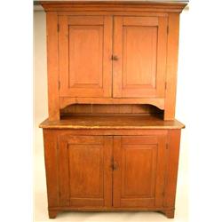 A RED STAINED PINE STEPBACK CUPBOARD