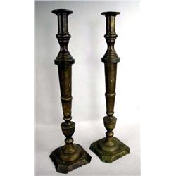 A PAIR OF LARGE BRASS CANDLESTICKS