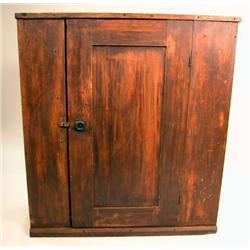 A RED STAINED MAPLE HANGING WALL CUPBOARD