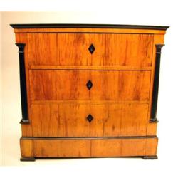 A BIEDERMEIER PART-EBONIZED AND FIGURED CHERRYWOOD CHEST OF DRAWERS