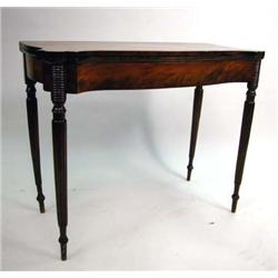 A FEDERAL CHERRYWOOD AND MAHOGANY VENEERED GAMES TABLE