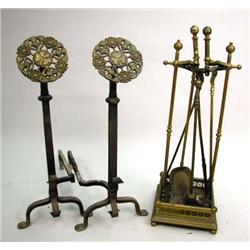 A PAIR OF ARTS AND CRAFTS CAST BRASS AND WROUGHT IRON ANDIRONS