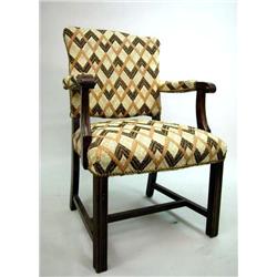 A GEORGE III STYLE UPHOLSTERED LIBRARY ARMCHAIR